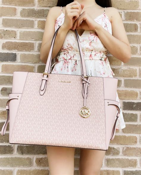 michael kors carryall bag|Michael Kors pink suitcase.